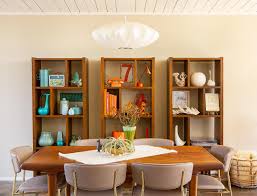 If you have the space, a full wall of bookshelves can turn your dining room into a combo library that really makes a statement. Tips For Styling A Bookcase Home