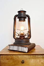 Lantern table lamps incorporate a lantern style in some form, whether that be in the base of the lamp or as part of the light fixture at the top. Electric Lantern Table Lamp For Bedrooms To Give You The Perfect Farmhouse Look Large 15 Inches