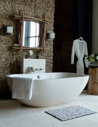 Simple geometric shapes (dominated by squares and rectangles), the predominance of white with a little neutral gray, a natural stone backsplash, and little in the way of decoration. 23 Natural Bathroom Decorating Pictures