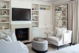 Turn your art into hinged screens that can easily unveil your television. Tv Built Ins Transitional Bedroom Jennifer Worts Design Bedroom With Sitting Area Master Bedroom Sitting Area Sitting Area Design