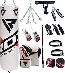 Man Punching Heavy Bag On Ground Heavy Bags Bags Workout Accessories