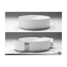 The rectangular table features a ball bearing swivel mechanism to allow the top to spin 360 degrees, transforming the 35.5 table to 47 in length. Viva Coffee Table With Drawer High Gloss White And White Glass Top