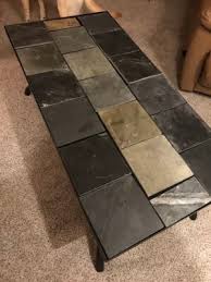 They can be purchased inexpensively and have nice straight edges. Signature Design By Ashley Antigo Slate Tile Raised Coffee Table Big Lots