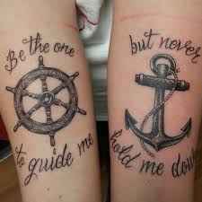 The black and gray anchor and compass contrast with the bright red ship wheel. 63 Best Anchor Tattoos Design And Ideas