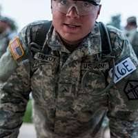 U.S. Marine Corps Cpl. Elliot Blake, right, provides