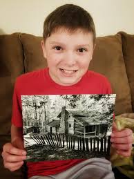 Young Daniel posing for a photo.