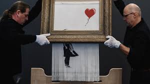 Art connoisseurs could only watch in horror as an expensive piece was shredded before their eyes. Banksy Love In The Bin S Internal Shredder Deactivated Bbc News
