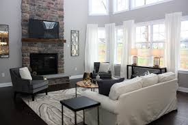 After Family Room Beige Sofa Gray Accent Chairs Geode Rug Mirrors Fireplace Tv Gold Black Home Staging Home Staging Companies Grey Accent Chair
