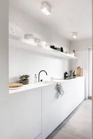 Studio mcgee shifted the attention of this narrow kitchen using graphic floor tile, which recedes into the distance, giving the illusion that the space is longer and larger than it really is. 40 Galley Kitchen Ideas And Designs Small Galley Kitchen Ideas