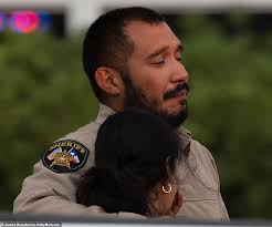 Distraught sheriff's deputy weeps over death of daughter, 10, in Texas  school massacre