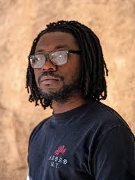 Jean-Juste, the man behind the camera at The Riverdale Press