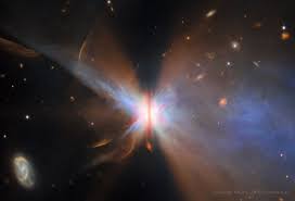 This butterfly can hatch planets. The nebula fanning out from the star IRAS 04302+2247 may look like the wings of a butterfly, while the vertical brown stripe down the center may look