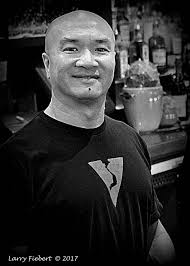 Waiter and diners at Parsons Table Date 1975-07-30 Photographer Fox, Bob  Subject Restaurants Diners (Restaurants) Waiters Geographic Subject  Philadelphia (Pa.) Personal Names Rodgers, Robert Kelly, Rose Chacker, Irv  Description "Robert Rodgers, a