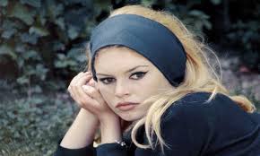 French actress and animal lover Brigitte Bardot pose for a photo with a  harp seal pub in Newfoundland, Canada. Mar 1977. Bardot traveled to  Newfoundland to publicly oppose seal hunting.