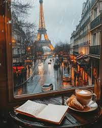 Rainy day in Paris cafe with a cup of latte