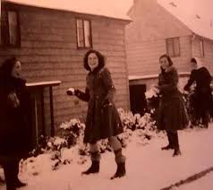 Winter 62/63. Building a giant Snowman in the field opposite. From right to  left Burt Salvary, Geoffrey Moore and Jonathan Tack. Can anyone name the  other two?