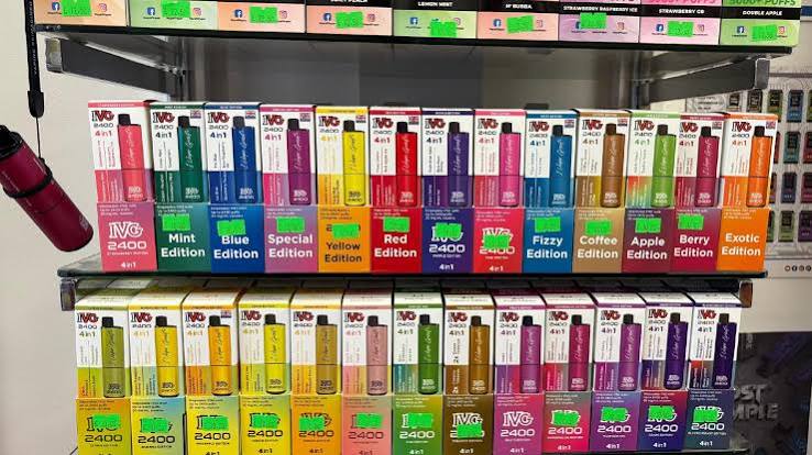 Retail display shelves stocked with IVG 2400 4 in 1 disposable vape flavor editions  VapeFeat buying guide