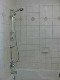 Take an old toothbrush or grout brush and scrub, removing the soap scum with it. Bring Your Grout And Tile Back To Life With The Grout Medic
