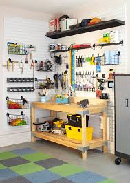 Features gun metal gray cabinets (gl custom steel) with a butcher block counter top, stainless steel pulls and a diamond plate backsplash. Garage Design Ideas Better Homes Gardens