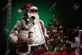 Toy Santa With A Whip Holds A Bear Dressed In Leather Harness Harness  Accessory For BDSM On The Background Of The Christmas Tree Stock Photo,  Picture And Royalty Free Image. Image 159936793.