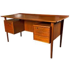 We've rounded up our selection for the best standing desks here to help point you in the right direction (image credit: Mid Century Teak Two Sided Desk At 1stdibs