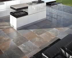 Here, concrete countertops, stone cabinets, and stone floor bring unity to the space. Home Architec Ideas Stone Kitchen Flooring Ideas