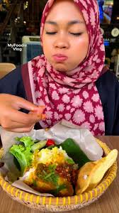 Rice patty fields like this one are integral in Laos. With over 60% of the  country's agriculture devoted to the grain, these fields are tied to its  natural landscape. This one, in