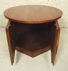 Prominent and bold, while also graceful. Midcentury Round Side Table With Storage For Sale At 1stdibs
