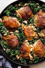 One Pot Braised Chicken With Kale And White Beans The Modern Proper Recipe Braised Chicken Braised Chicken Thighs Chicken Dinner