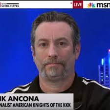 A KKK leader was found dead by a river. His wife and stepson are charged  with murder.