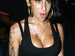 She was known to have around 14 tattoos all over her body. 30 Drop Dead Gorgeous Amy Winehouse Tattoos Slodive