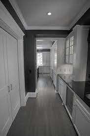 To match your gray flooring to your walls select a flat gray paint that is the same shade or lighter in color for best results. Gray Hardwood Floors Design Ideas Pictures Remodel And Decor Small Basement Remodel Grey Hardwood Floors Brown Living Room Decor