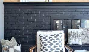 Keep it harmonized by having a shiny black mantel that matches the black and white picture frames above it. How To Paint Your Brick Fireplace Black And Never Look Back
