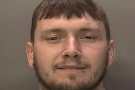 Smirking man's mugshot released as he's wanted for string of suspected  crimes