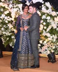 Priyanka chopra arrives to the royal wedding ceremony in lavender vivienne westwood. Priyanka Chopra S First Wedding Pictures Are Out Priyanka Chopra Wedding Indian Wedding Outfits Indian Bridal Dress