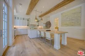It has a shelf to store wine bottles, hooks to hang utensils and rags and a lower shelf for additional you can also attach some hooks and a bar for storing kitchen towel. 45 Kitchens With Built In Tables Photos Home Stratosphere
