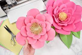These paper flowers add a whimsical touch to a child's bedroom or playroom either hanging on the wall or tucked into the corner of a bookshelf for decoration. How To Make Large Paper Flowers Easy Diy Giant Paper Flower