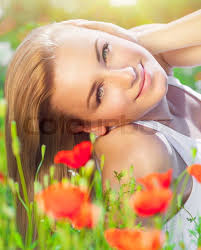 Beautiful woman enjoying daisy field and blue sky, nice fema