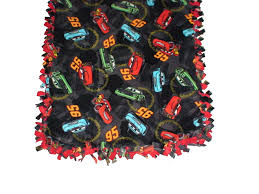 Lay the blanket stuffing and 2nd piece of fleece directly on top of the first piece (make sure it's right side up!) 2) smooth out the fabric wrinkles and match up all corners 3) cut out a square on each of the 4 corners, use your 4 cardboard template to ensure neatness No Sew Fleece Blankets