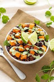 Sweet Potato And Black Bean Quinoa Bowls A Delicious Filling Meatless Meal That Will Please Vegetarian Recipes Healthy Recipes Stuffed Sweet Potato Healthy