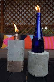 An Easy Step By Step Tutorial And Video On How To Make Tabletop Concrete Tiki Torches Out Of Used Glass Bottles Concrete Diy Tiki Torches Diy Bottle Torch