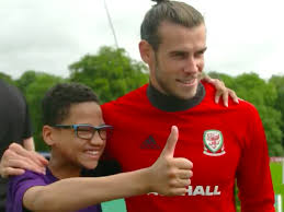 Footballer for @spursofficial and @fawales twitter: Gareth Bale Wales Fan Curtis Meets His Hero In Viral Video
