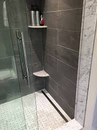 Infinity Shower Drain Gray Slate Porcelain Will Tile And Barn Style Shower Door What S Not To Love Www Tchomebuil Home Builders Shower Drain Bathroom Decor