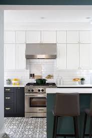 Transitional Kitchen With Two Toned Cabinetry Features A Spruce Green Island With A White Quartz Counterto Transitional Kitchen Leather Kitchen Kitchen Remodel