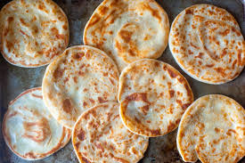 Drizzle the flatbreads with yogurt sauce, sprinkle with salt and parsley, cut into slices and serve. Layered Yogurt Flatbreads Smitten Kitchen
