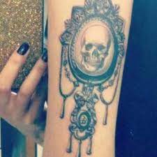 Here's a tattoo i've never seen before! 20 Skull Cameo Tattoo Designs