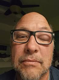 I've seen this several mornings. The door bell has a light. Evidently it's  enough to warm a little bee body