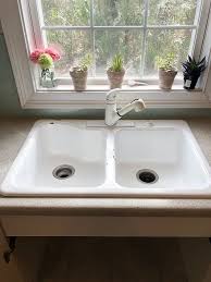 Form a length of plumbers putty and wrap the putty around the underside of the overhang on the sink strainer. How To Install A Farmhouse Drop In Sink Hometalk