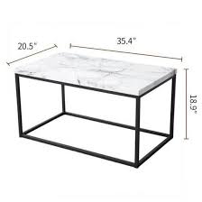 This coffee table from west elm fuses the industrial with the rustic, made from solid mango wood with a blackened steel frame. White Marble With Black Metal Box Frame Coffee Table Paiastone Com