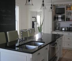 Transitional kitchen with off white colored cabinets, white subway tile backsplash, and white quartz countertops. Dual Kitchen Sink Traditional Kitchen Benjamin Moore White Dove House Home
